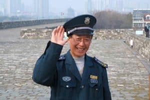 A Nanjing City Wall staff member - keen to show me more good examples of stamped bricks.
