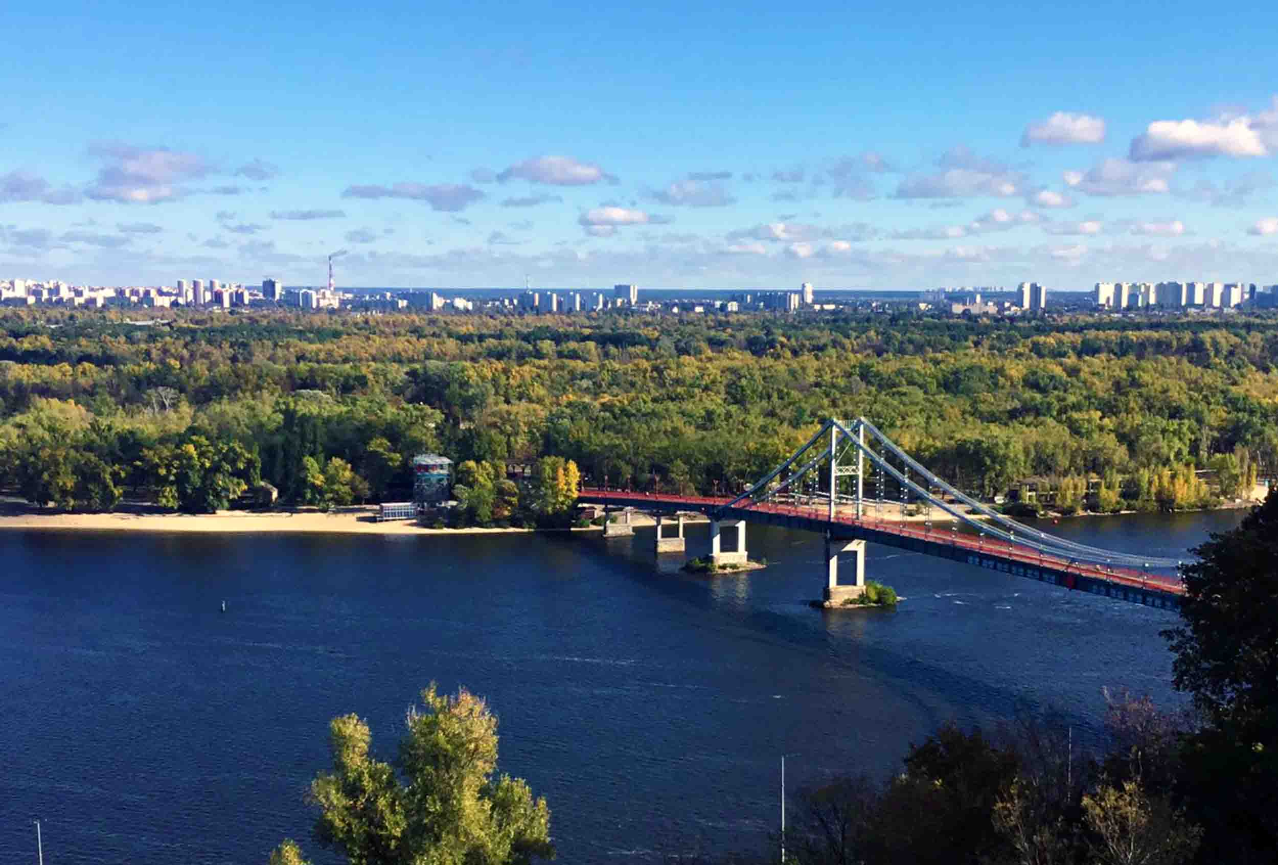 The view across the Parkovy Pedestrian Bridge to Trukhaniv Island in the Dnipro River, Kyiv.